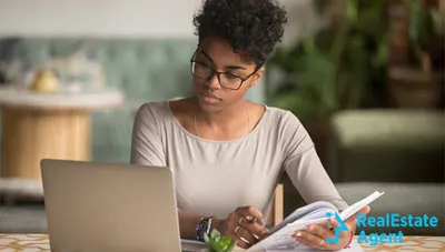 afro american young woman making a study on insurance policies