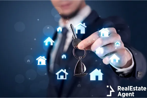 business man in suit holding keys