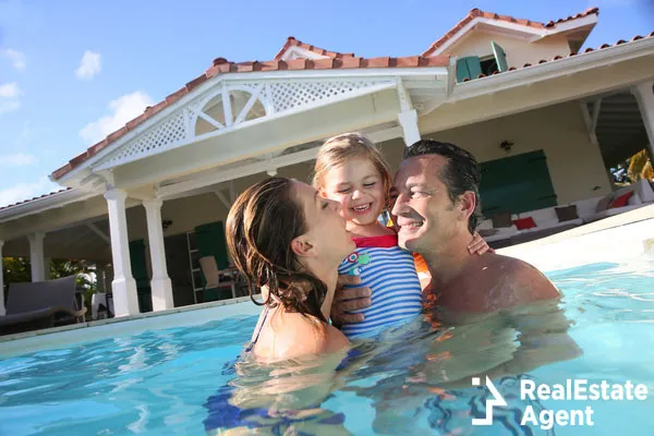 family playing swimming pool