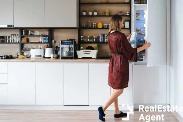 hungry woman looking food fridge