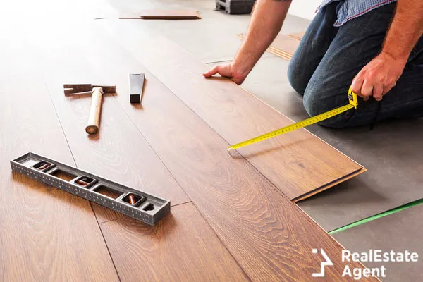 man installing floor