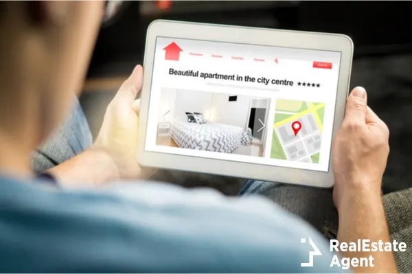 man search for apartments on a tablet