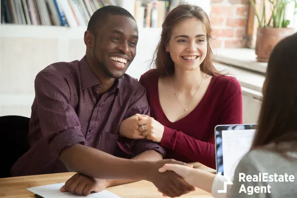 multiracial couple customers shaking hands