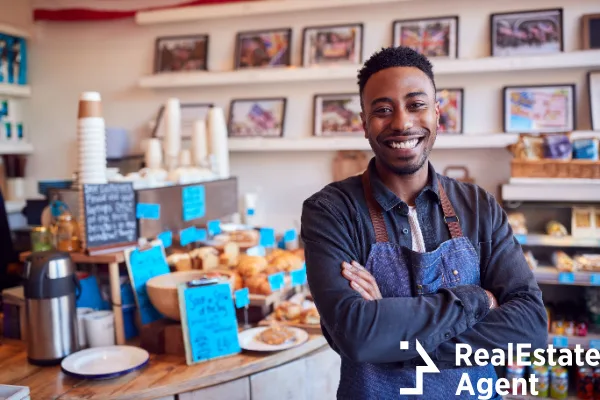 portrait smiling male owner coffee shop