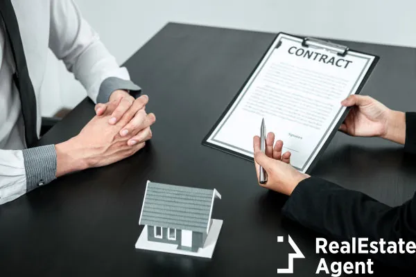 real estate agent presenting home loan contract