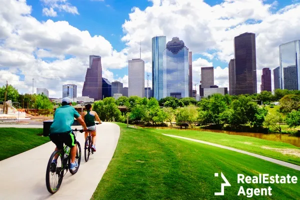 riding bike on paved trail in houston park