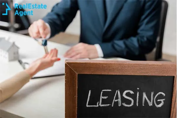 Leasing concept with businessman handing keys