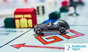 How to buy a house quickly race with a monopoly car on a real estate board