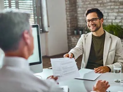 young man happy to apply for a job giving his CV