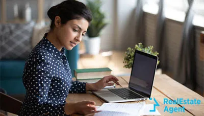 young woman checking her options on laptop