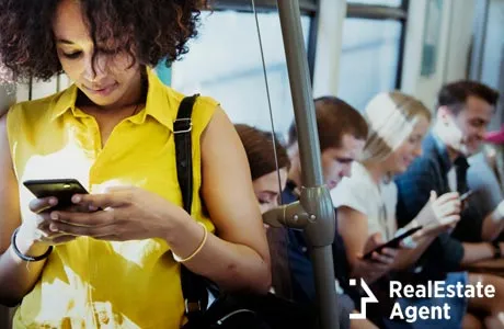 young woman using cellphone in subway